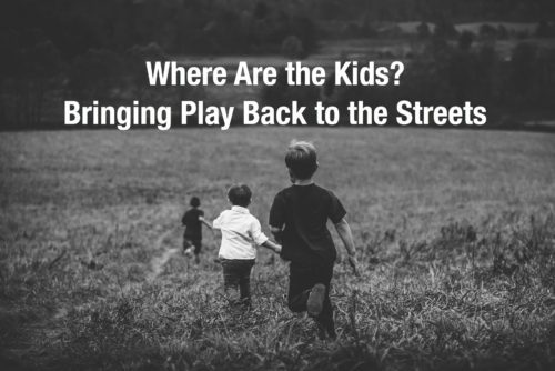 three kids running in a field